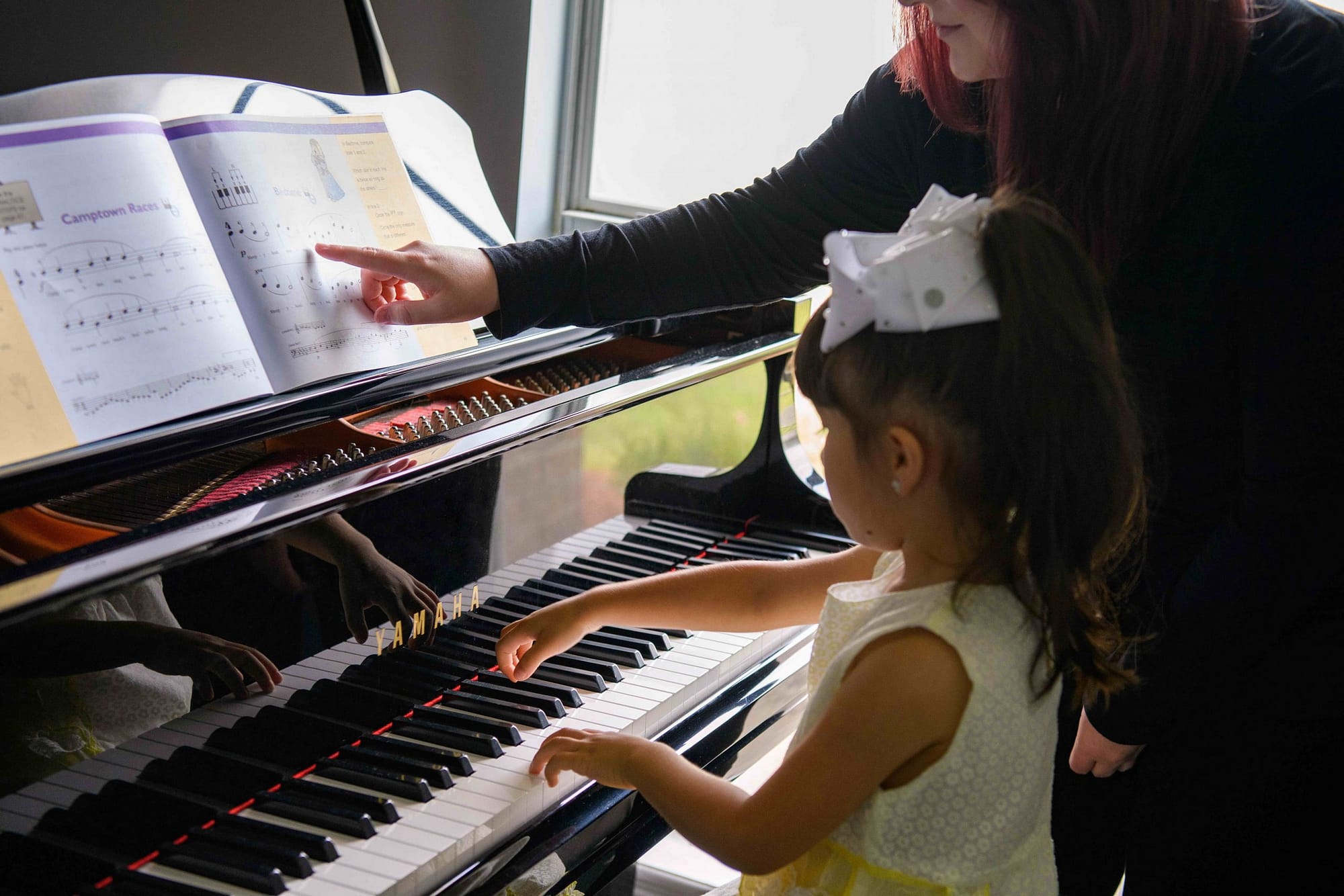 Preschool piano lesson with teacher