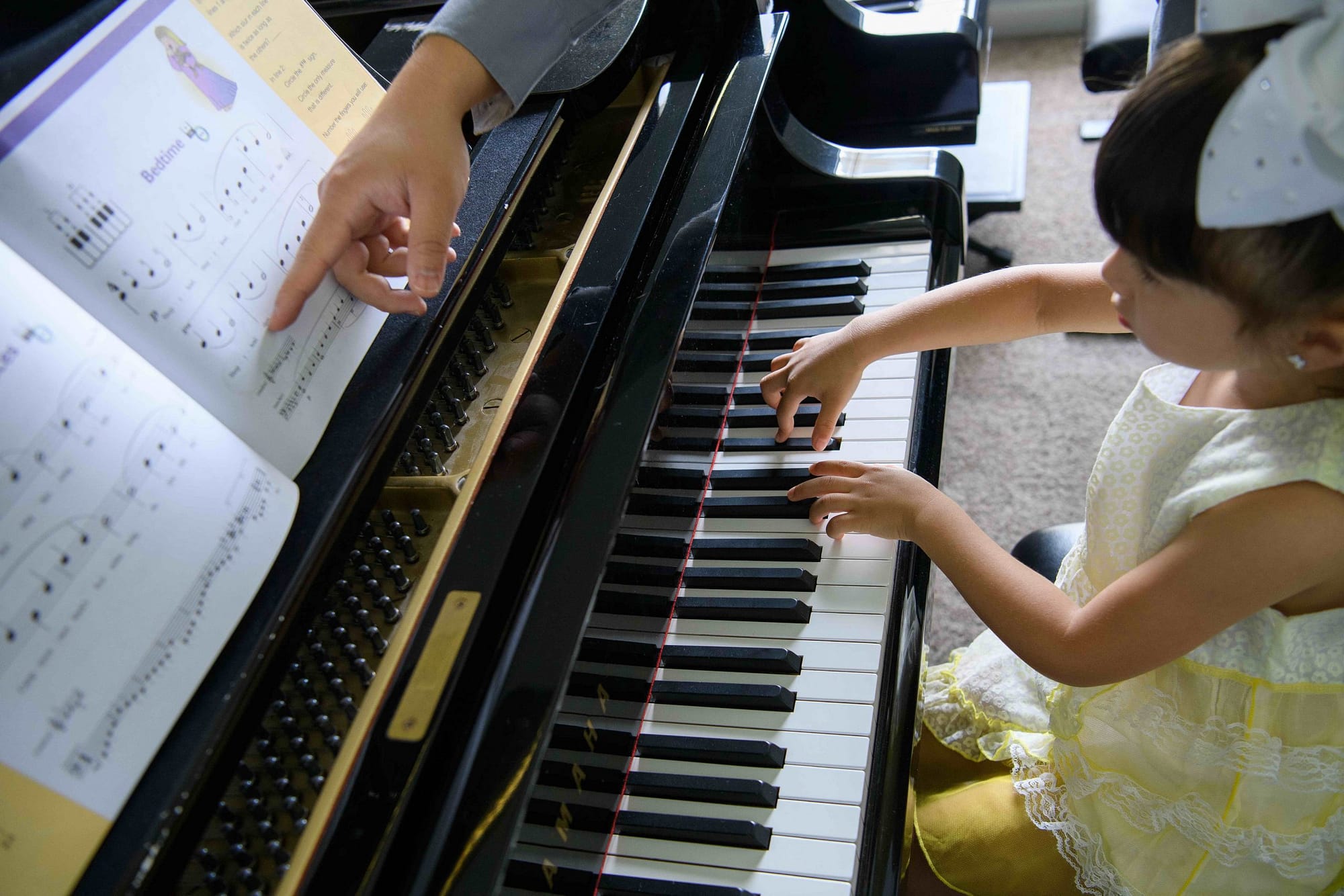 Preschool piano lesson with teacher