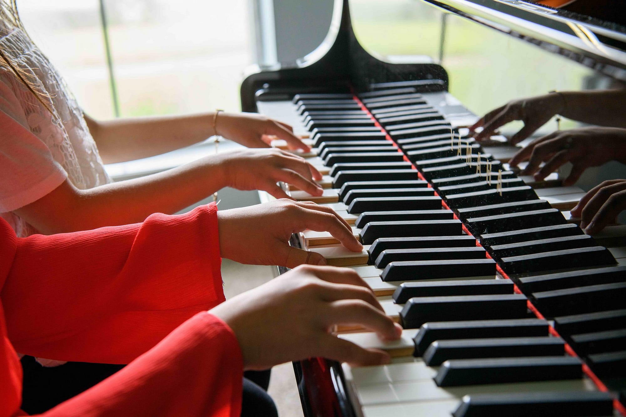 Piano students duet hands